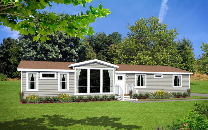 Westridge manufactured home with large front windows with flowerbeds on a large lawn and the branch and shadow of a shade tree in the foreground.