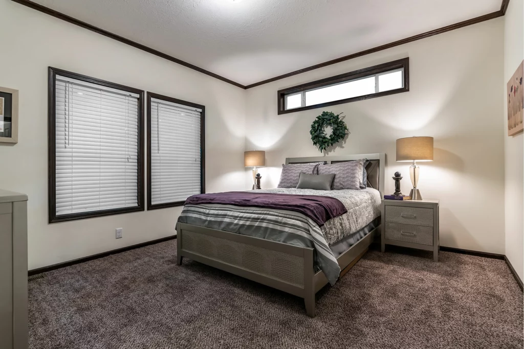 Skyline Homes Arlington 2275P Modular Home Master bedroom featuring large windows and carpet floors
