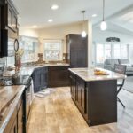 Skyline Homes Westridge 1218CT Manufactured Home Kitchen featuring island with living room in backdrop