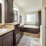 Skyline Homes Westridge 1218CT Manufactured Home Master bathroom featuring double vanity, garden tub, and shower