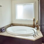 Skyline Homes Westridge 1218CT Manufactured Home Master bathroom featuring garden tub and textured glass window above