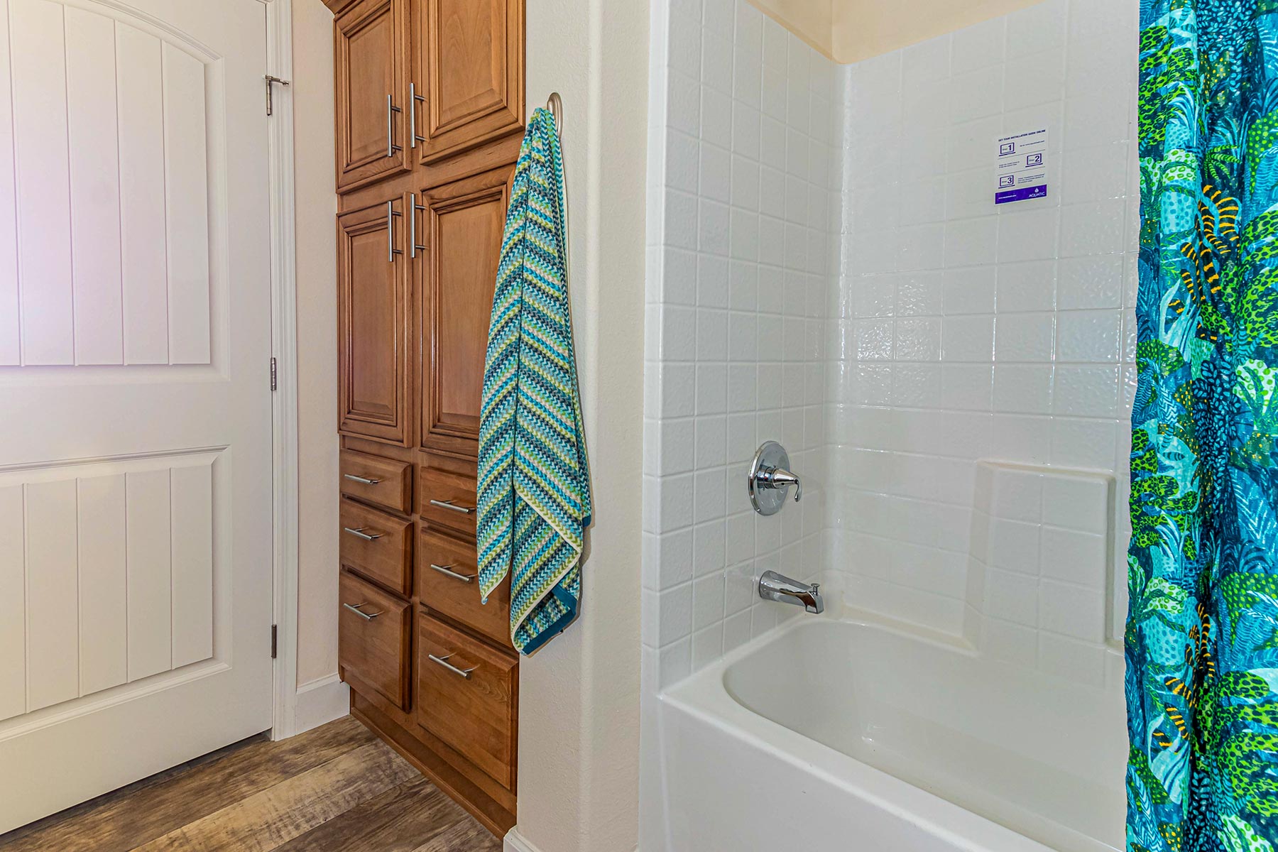 Skyline Homes Westridge 1473CT Manufactured Home Second bathroom featuring single vanity, shower bath, linen cabinet, toilet