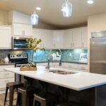 Skyline Homes Westridge 1492CT Manufactured Home Kitchen featuring island, appliances, pantry