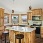 Skyline Homes Westridge 1218CT Manufactured Home kitchen featuring island, appliances, and ceiling lights