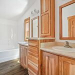 Skyline Homes Westridge 1218CT Manufactured Home Primary bathroom featuring double vanity and shower bath