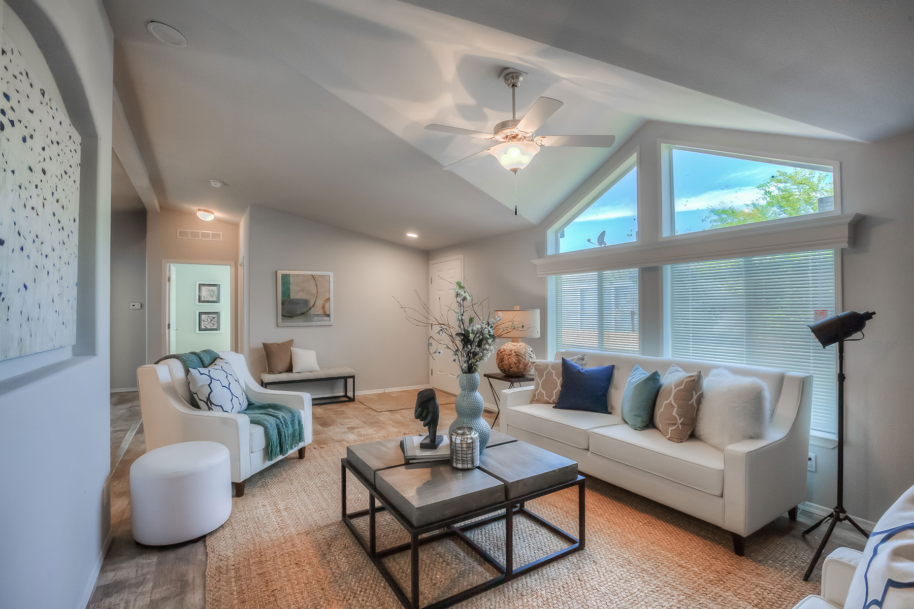 Skyline Homes Westridge 1222CT Manufactured Home Living room featuring ceiling fan, vaulted ceiling, large windows