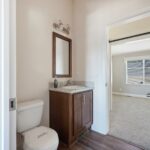 Skyline Homes Westridge 1227CT Manufactured Home Second bathroom featuring single vanity, shower, toilet