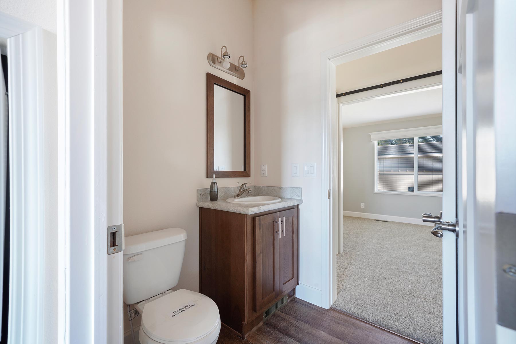 Skyline Homes Westridge 1227CT Manufactured Home Second bathroom featuring single vanity, shower, toilet