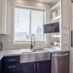 Skyline Homes Westridge 1260CT Manufactured Home Kitchen featuring island, pantry, appliances, small window