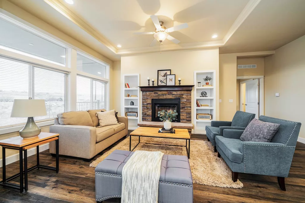 the westridge 1492ct manufactured home floorplan features a fireplace, a coved ceiling and built-in bookcases