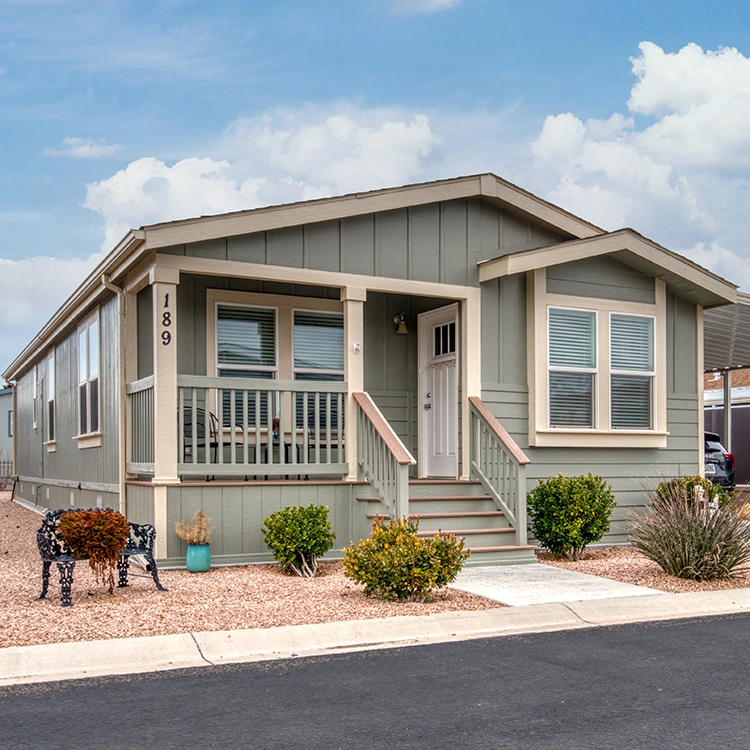 Exterior of a beautiful, modern manufactured home with a blue sky in the background