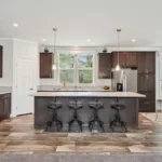 open kitchen concept with kitchen island and bar seating, granite counters, dark wood cabinets, nickel hardware, and stainless steel appliances