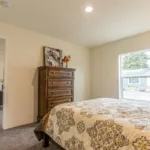 primary bedroom attached to the living room