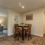 small dining corner next to a utility closet